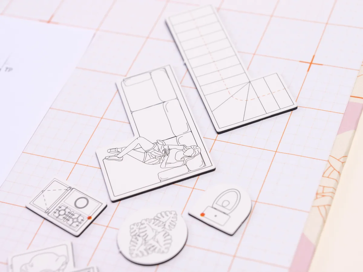 Des magnets mobilier Nokutch posés sur un plan d’aménagement au 1:50